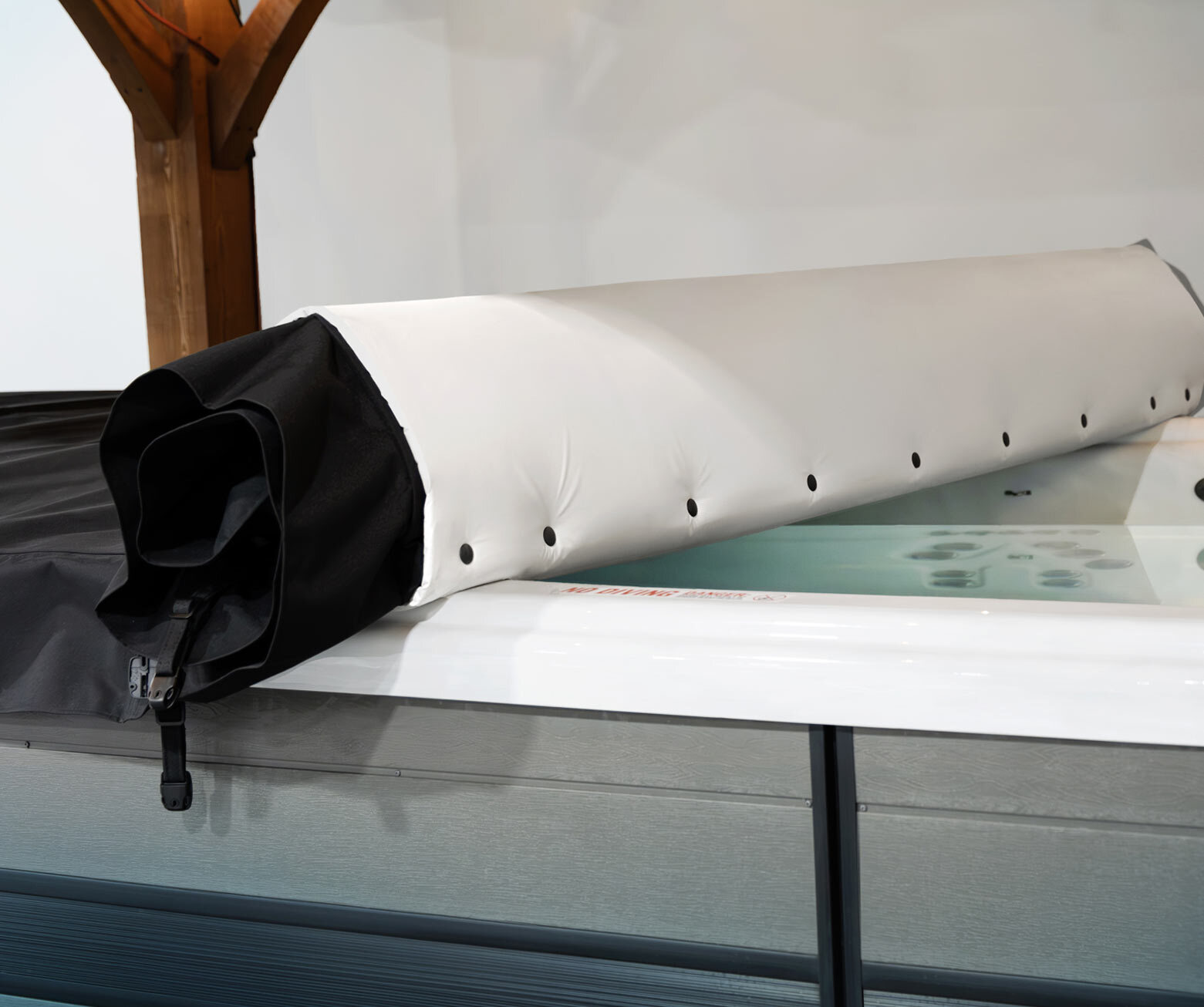 Unrolling the axis cover system on a master spas swim spa