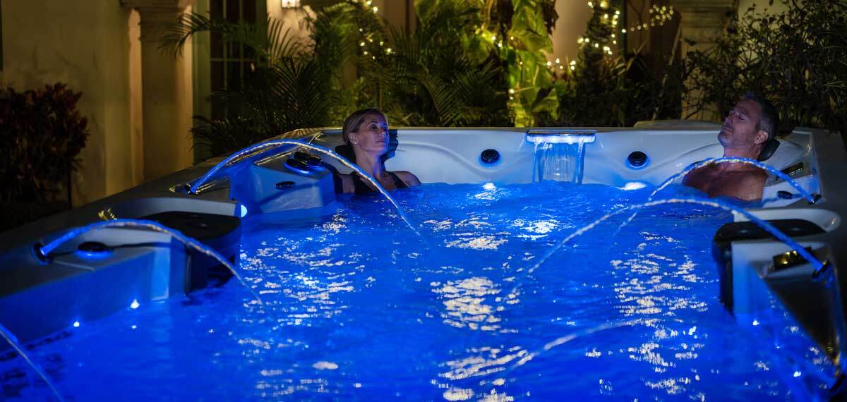 A swim spa in the backyard.